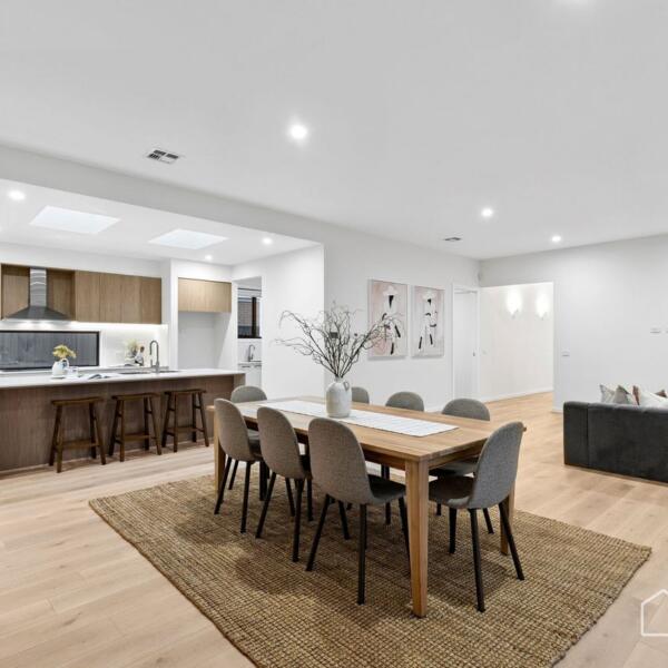 Open-plan kitchen, dining and living area in a custom new home built in Lara by a Geelong home builder